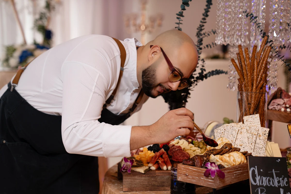 A guest at the charcuterie display at Nencini Ballroom