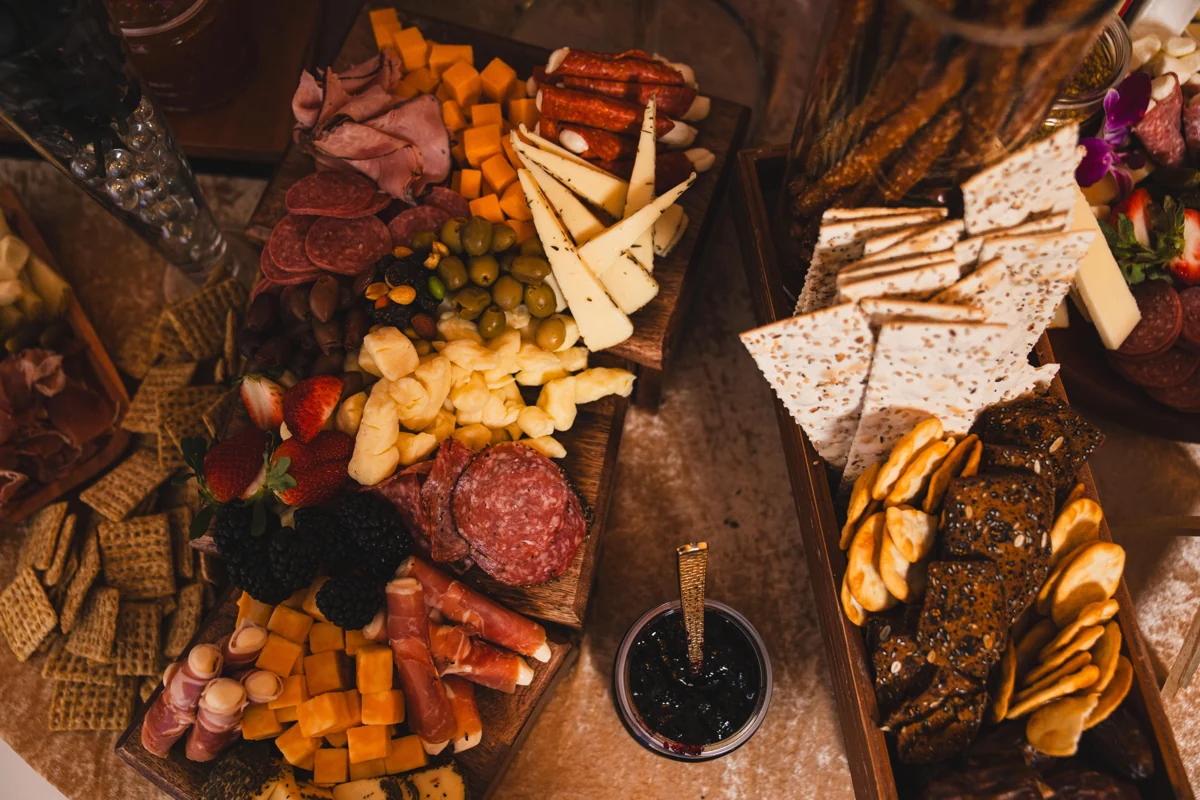 Overhead view of charcuterie, cheese, crackers and fruit